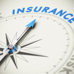 Compass needle pointing the word insurance. Concept image blue and beige tones