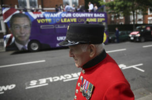 A Chelsea Pensioner passes in front of the UK Independence Party (UKIP) pro-brexit campaign bus, parked in front of the Chelsea Flower Show in London, Britain May 28, 2016. REUTERS/Neil Hall - RTX2EM4X