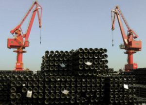Cranes are seen above piles of steel pipes to be exported at a port in Lianyungang, Jiangsu province, China, December 1, 2015. REUTERS/China Daily/File Photo