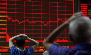 Investors monitor a display showing the Shanghai Composite Index at a brokerage in Beijing, Monday, Aug. 31, 2015. Asian stocks fell Monday after a U.S. Federal Reserve official suggested a September interest rate hike still was possible and Japanese factory activity weakened. (ANSA/AP Photo/Ng Han Guan)