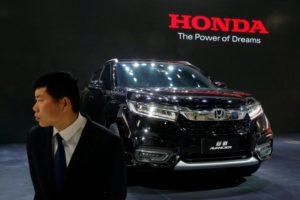 A security agent guards Honda Avancier SUV after it was presented during Auto China 2016 auto show in Beijing, China April 25, 2016. REUTERS/Kim Kyung-Hoon/File Photo