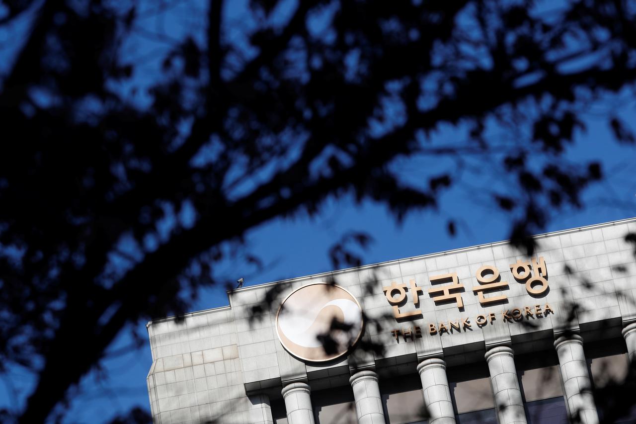 South Korea central bank surprises with rate cut, likely to loosen again